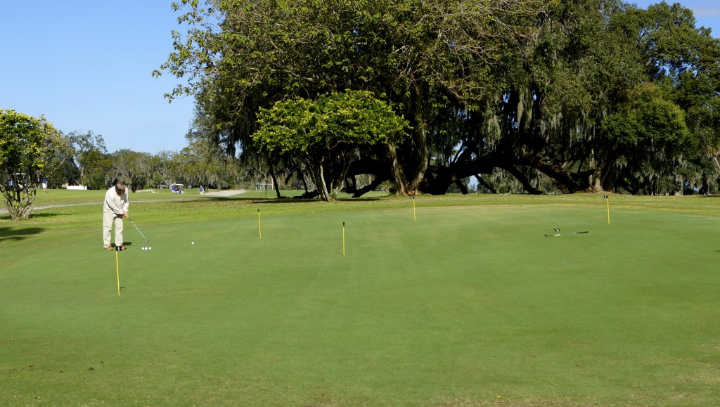 golfer practicing at the putting area