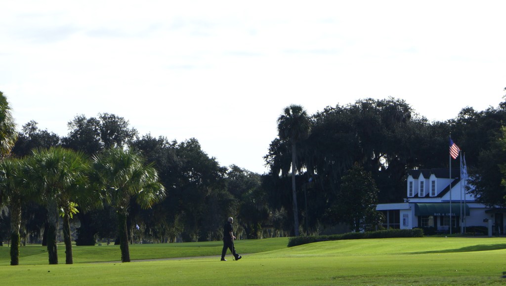 golfer walking on the fairway